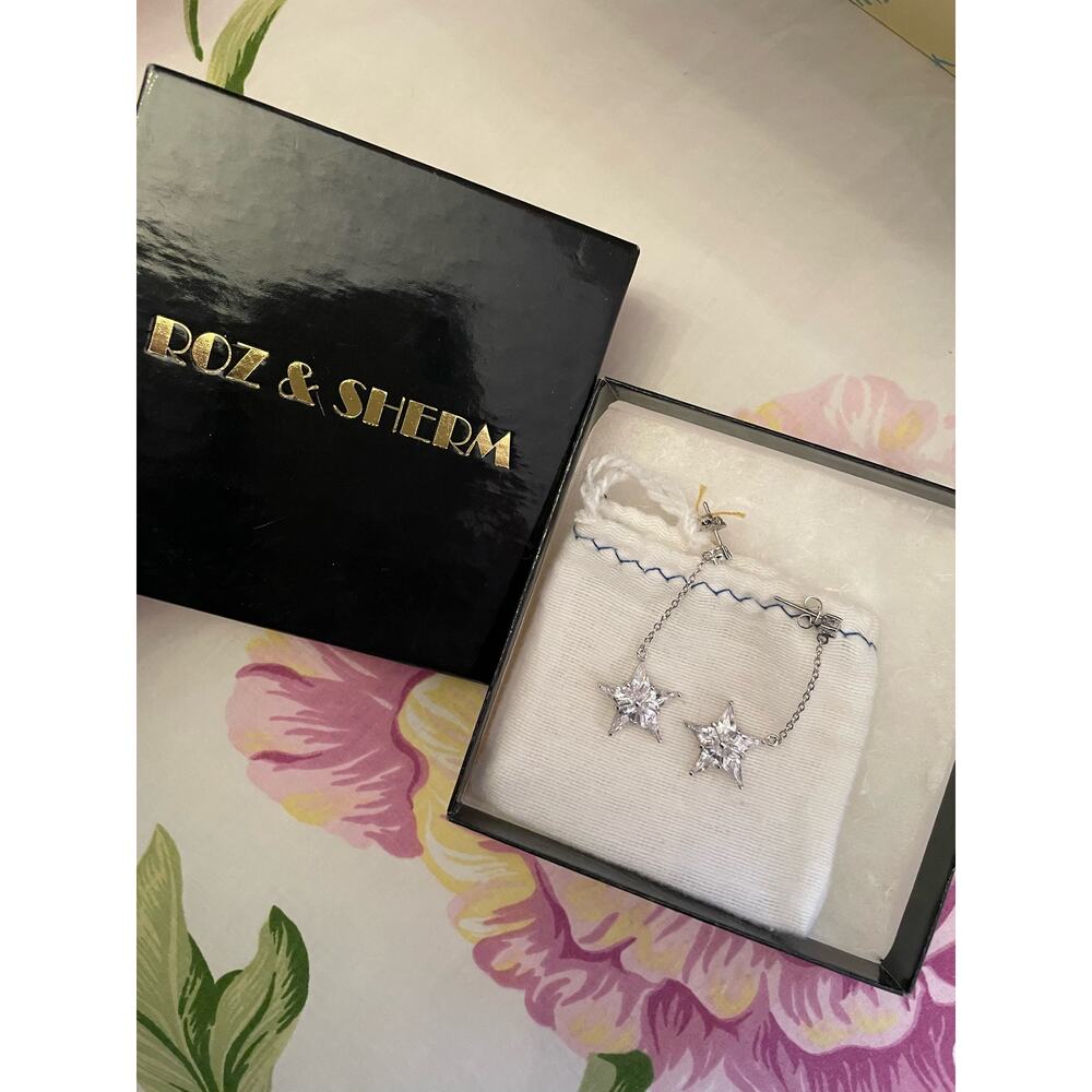 Roz and Sherm silver dangly star earrings NIB